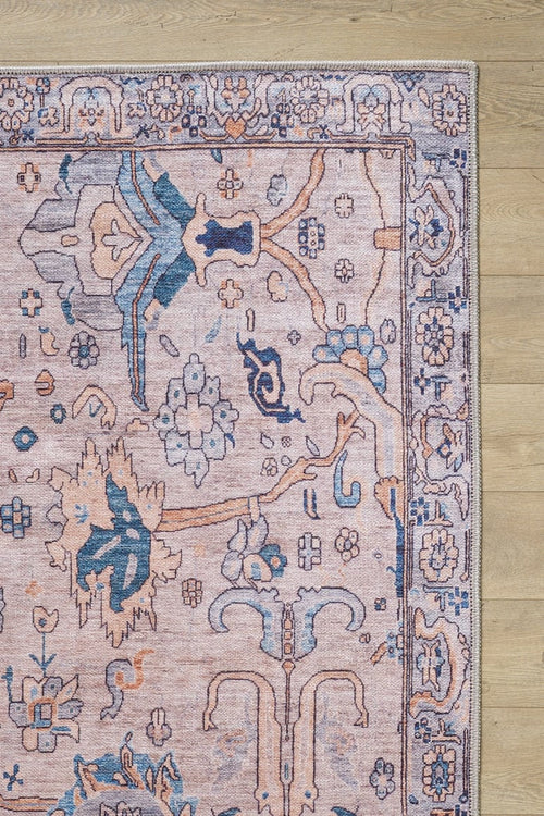 Bild 1 in Galerieansicht laden. A close-up of the Luminary Beige Gray Washable Rug - LCC3023 (Custom Size), featuring a traditional floral pattern in pink, blue, and beige on a light wood floor. Only the corner and part of the rug’s edge are visible—perfect for high-traffic areas.