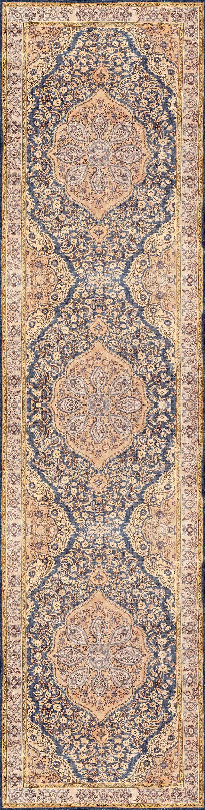 The Majestic Crest - Washable Rug (JRN1015) is a long, Persian-style area rug featuring detailed floral and geometric patterns in blue, beige, and tan, highlighted by three central medallions and ornate borders.