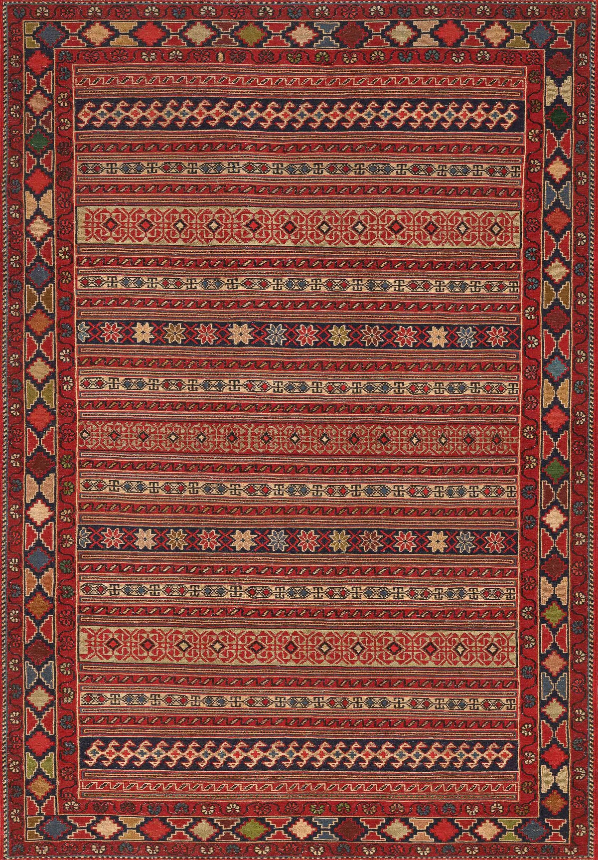 The Majestic Loom - Washable Rug - JRN1003 features colorful Southwestern-inspired rows of geometric shapes, diamonds, and florals in red, blue, green, beige, and gold with a detailed patterned border—bringing vibrant style to any space.