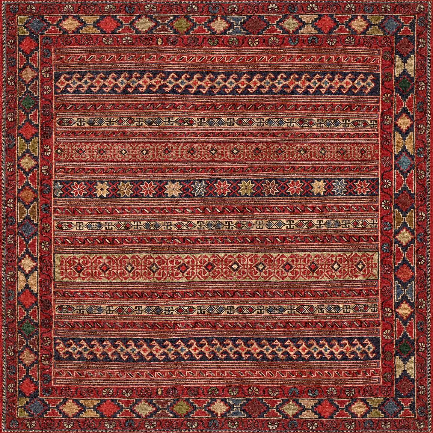 The Majestic Loom - Washable Rug - JRN1003 features traditional red hues, intricate geometric patterns, and horizontal bands in gold, navy, and ivory. Framed by earthy tones, this rug is both decorative and easy to clean for effortless care.