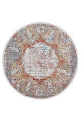 The Medallion Remix Colorful Premium Rug - MT120 is a round, machine-made rug with a distressed vintage medallion pattern in red, blue, gold, and ivory, inspired by classic Turkish designs.