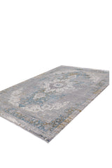 The Medallion Revamp Modernised Medallion Rug - MT002 is a rectangular machine-made rug with distressed blue, gray, and beige tones, featuring ornamental and geometric designs. Shown on a white background.