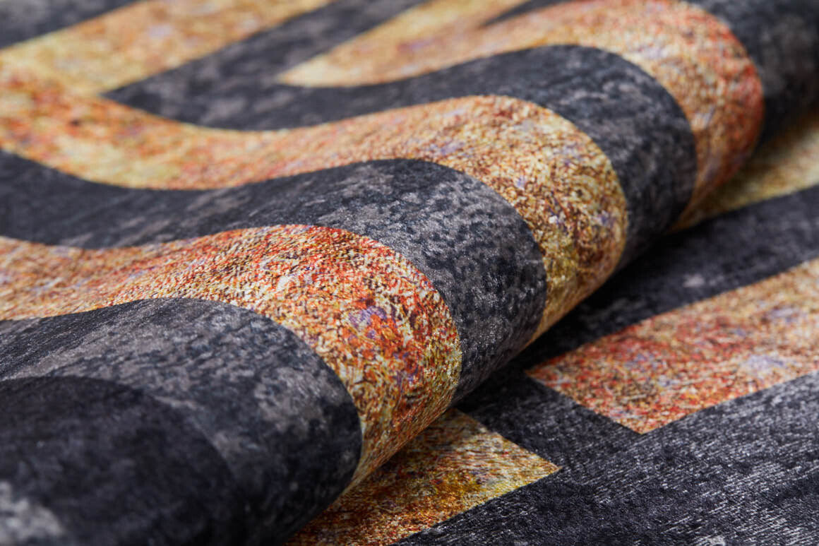 A close-up of the Minimalist and Clean - Washable Rug - JR1407 (Custom Size) shows bold, wavy stripes in dark gray and speckled orange, highlighting detailed fibers—perfect for high-traffic areas.