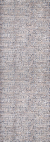 A close-up of the Modern Enigma - Machine-Washable Rug JR1883 shows textured, woven gray and light blue fabric with a subtle, irregular pattern—perfect for high-traffic areas.