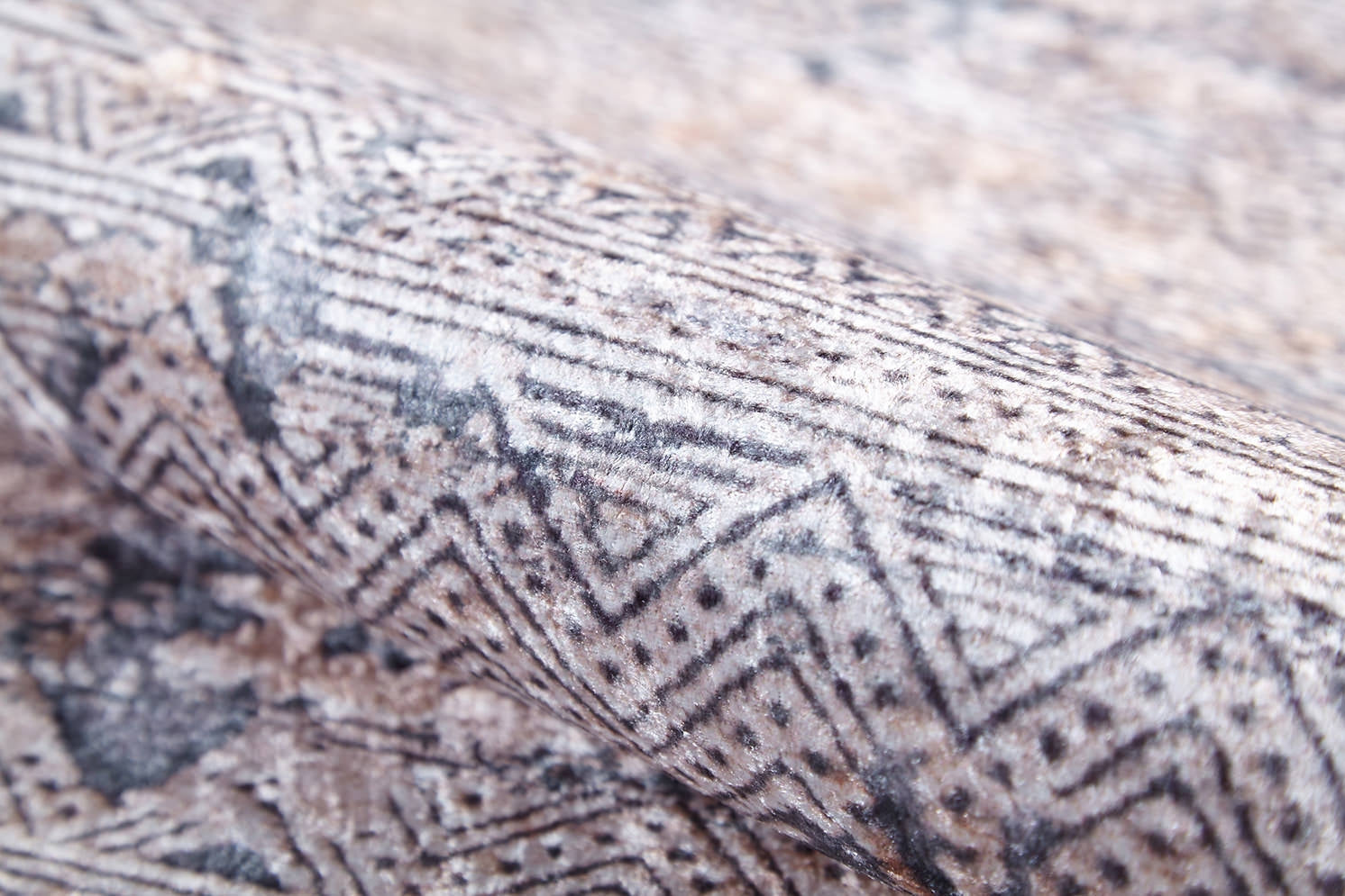 A close-up of the Modern Enigma - Machine-Washable Rug JR1883 (Custom Size) highlights its geometric zigzag and dotted pattern in gray and beige, ideal for high-traffic areas or inspiring cream and beige decor styles.