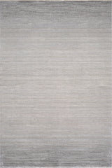 The Muted Palette Grey Ombre Rug - EW2636 is a modern, machine-made rug in neutral tones, showcasing a subtle gradient from light gray center to darker edges with a soft, textured weave.