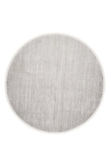 The Muted Palette Grey Ombre Rug - EW2636 is a modern, machine-made round area rug in light gray ombre tones with a subtle textured pattern and thin pale border, shown from above on a white background.
