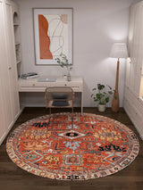 A cozy home office features a white desk and chair, the Mystral Kilim-Design Coral Washable Rug - LCC3015 (Custom Size), a potted plant, floor lamp, abstract wall art, and built-in white shelves and cabinets.