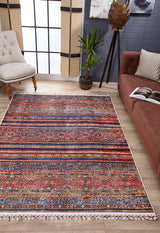 A living room featuring the Native Nightscape - Washable Rug - JR5093 (Custom Size) in multicolor on a wooden floor, paired with a brown sofa, beige tufted chair, potted plant, large windows with blinds, and décor against a gray wall. Perfect for high-traffic spaces.