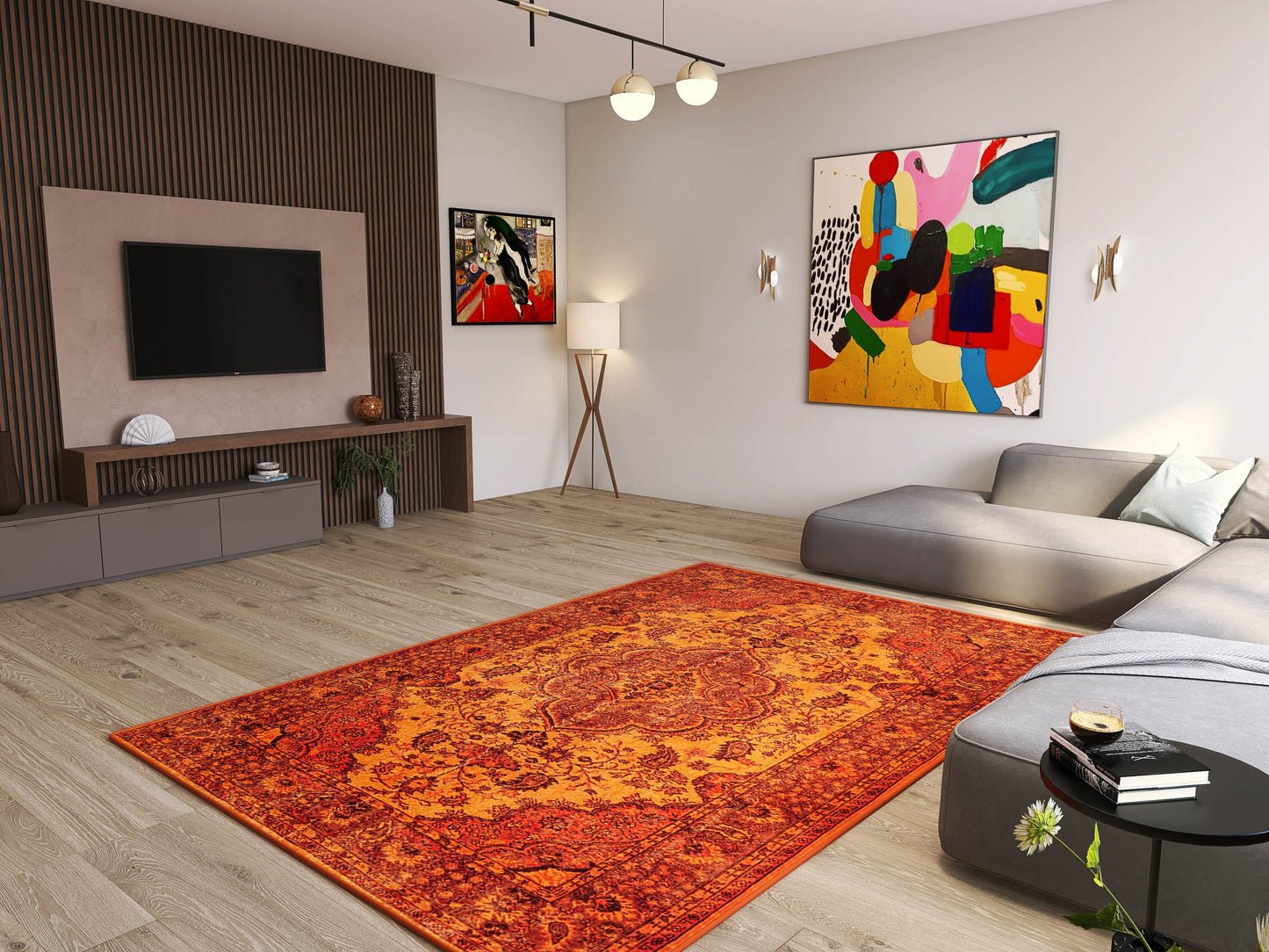 Modern living room with light wood floors, a large Noble Odyssey - Washable Rug - JRN1012 (Custom Size) in orange, gray sectional sofa, wall-mounted TV, abstract art, floor lamp, minimalist decor, and sunlight streaming through the window.