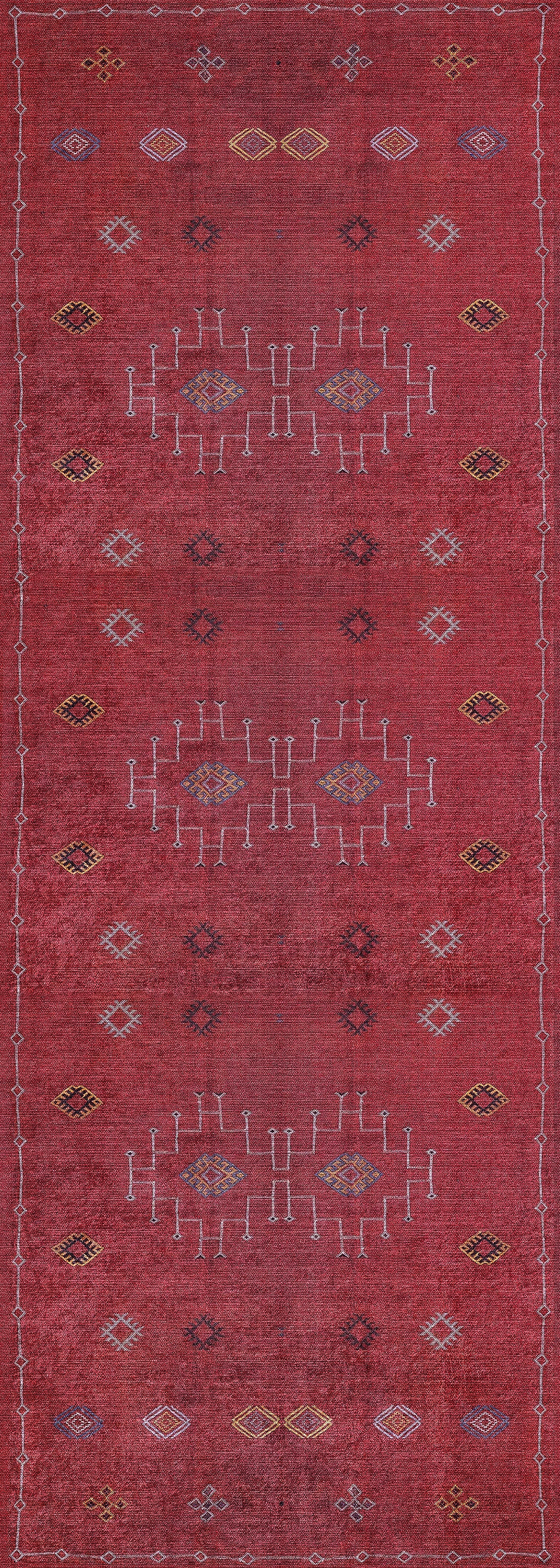 The Nomadic Journey - Washable Rug - JR5080 is a long red rug with a distressed look, featuring yellow, white, and blue geometric patterns, including white lines and diamond shapes. Durable for high-traffic areas and easy to clean.