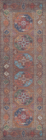 The Nomadic Oasis - Washable Rug - JR5086 features a traditional flat weave with geometric patterns in red, brown, blue, white, and green. Its central hexagonal medallions and angular motif border create an intricate, symmetrical design.