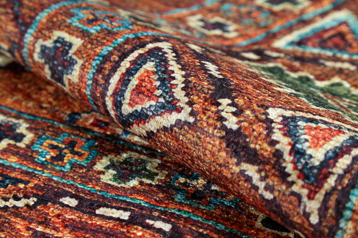 A close-up of the Nomadic Oasis - Washable Rug - JR5086 (Custom Size) reveals vibrant geometric patterns in red, orange, blue, green, and cream—showing detailed texture and ideal for allergy-sensitive or high-traffic areas.