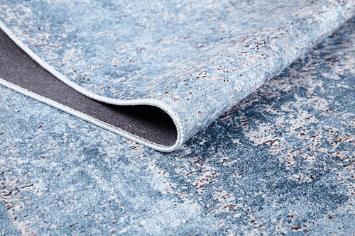Load image 1 in gallery view. A close-up of the Old World Charm - Washable Rug - JR1606 (Custom Size) in blue and gray, with a corner lifted to show the underside and edge stitching—ideal for high-traffic areas.