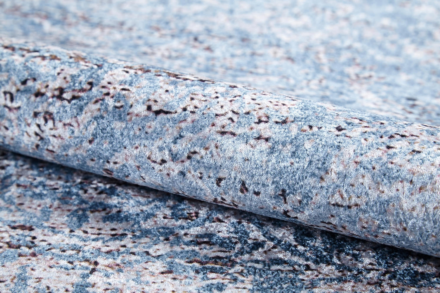 A close-up of Old World Charm - Washable Rug - JR1606 (Custom Size), a blue and gray textured carpet with a speckled, abstract pattern—perfect for high-traffic areas.