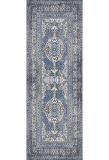 The Opulent Beauty - Washable Rug - JR1932 is a rectangular blue rug with an intricate symmetrical pattern in blue, white, and gray, featuring central medallions and ornate borders—ideal for high-traffic areas.