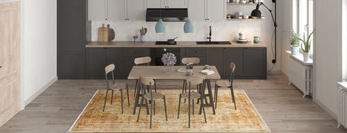 Load image 1 in gallery view. Modern kitchen and dining area with a wooden table, six chairs, light wood floors, black and white cabinetry, pendant lights, large windows, and the Ornate Beauty - Washable Rug - JR206 in yellow—ideal for high-traffic spaces.