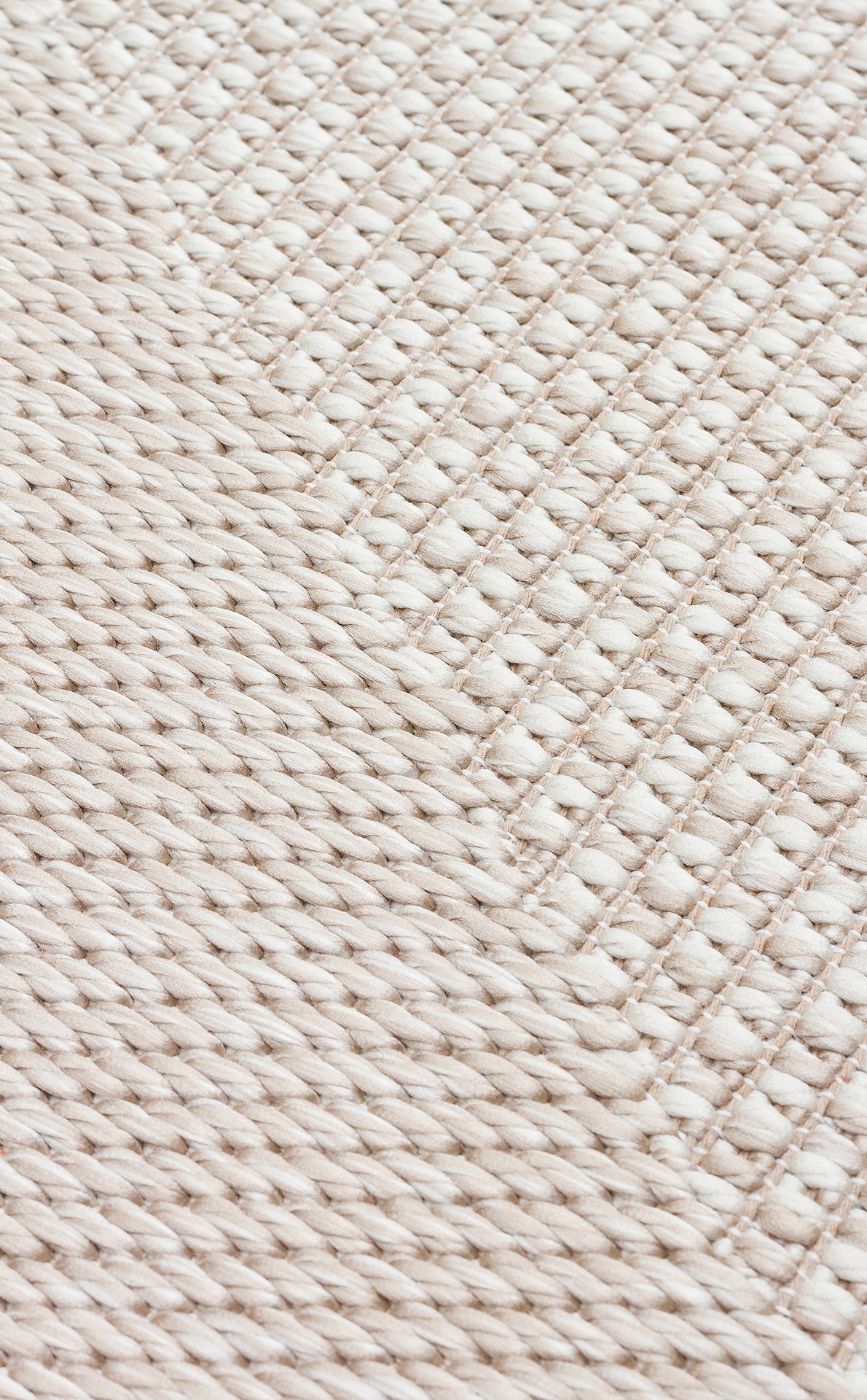Close-up of the Pale Shadow - Kilim - MNO03, showcasing its textured beige surface with diagonal, thick twisted strands and tightly interlaced threads—an ideal detail for modern rug or kilim lovers.
