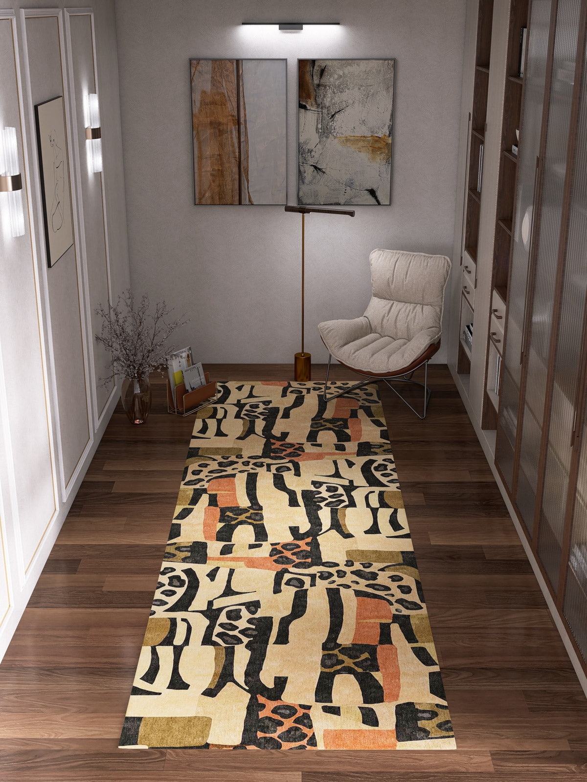 A modern hallway with a wooden floor, the Pastel Harmony - Washable Rug - JRN43 featuring abstract patterns, a beige lounge chair, decorative vase, books, and two abstract artworks on softly lit walls.