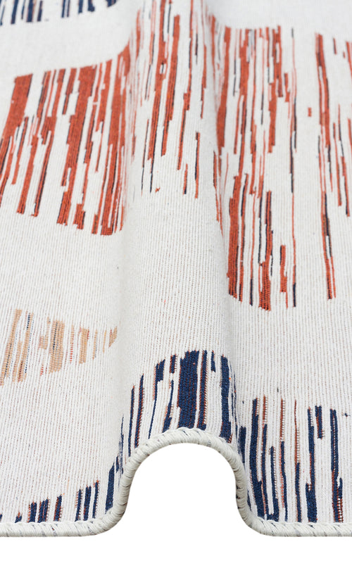 Load image 1 in gallery view. A close-up of Pattern Field - Washable Reversible Kilims - AR38 shows white textured fabric with wavy folds and abstract vertical stripes in red, navy blue, and peach, resembling a flatwoven rug. The curved fabric edge appears in the foreground.
