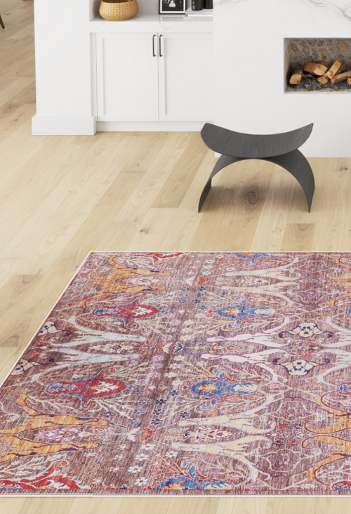 Bild 1 in Galerieansicht laden. The Peregrine Peachy Brown Washable Rug - LCC3022 (Outlet) US adds color and pattern to a modern living room with white cabinets, a fireplace, light wood floors, and a unique black curved stool.