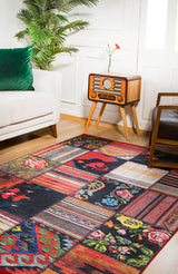 The Petal Paradise - Washable Rug - JR315 (Custom Size) with vibrant geometric and floral patterns brightens a wooden floor beside a white sofa, making it ideal for high-traffic spaces and adding a cozy touch to the room.