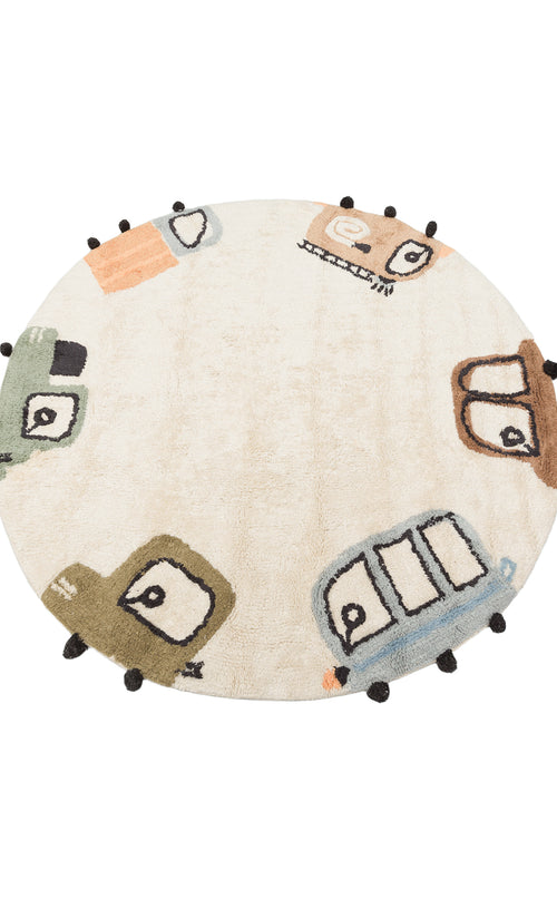 Load image 1 in gallery view. The Play Patch - Washable Shaggy - CBN15 is a round, cream-colored kids rug featuring cartoon car designs in green, orange, blue, and brown around the edge with black pom-poms—perfect as a children’s room rug.