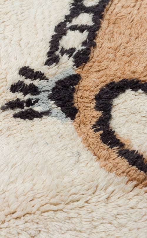 Load image 1 in gallery view. Close-up of Play Patch - Washable Shaggy - CBN15, a cream woven rug with black and brown abstract patterns. This soft, plush, and washable textile is perfect for adding comfort and style to any children’s room.