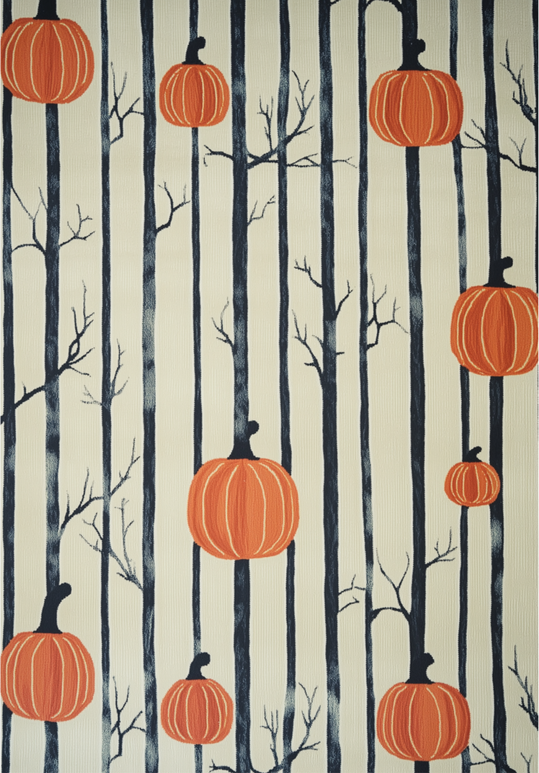 The Pumpkin Grove - Washable Rug - HLW002 features tall black tree trunks with bare branches on a cream background, accented by large orange pumpkins. This allergy-friendly flat weave rug is easy to clean and perfect for seasonal style.