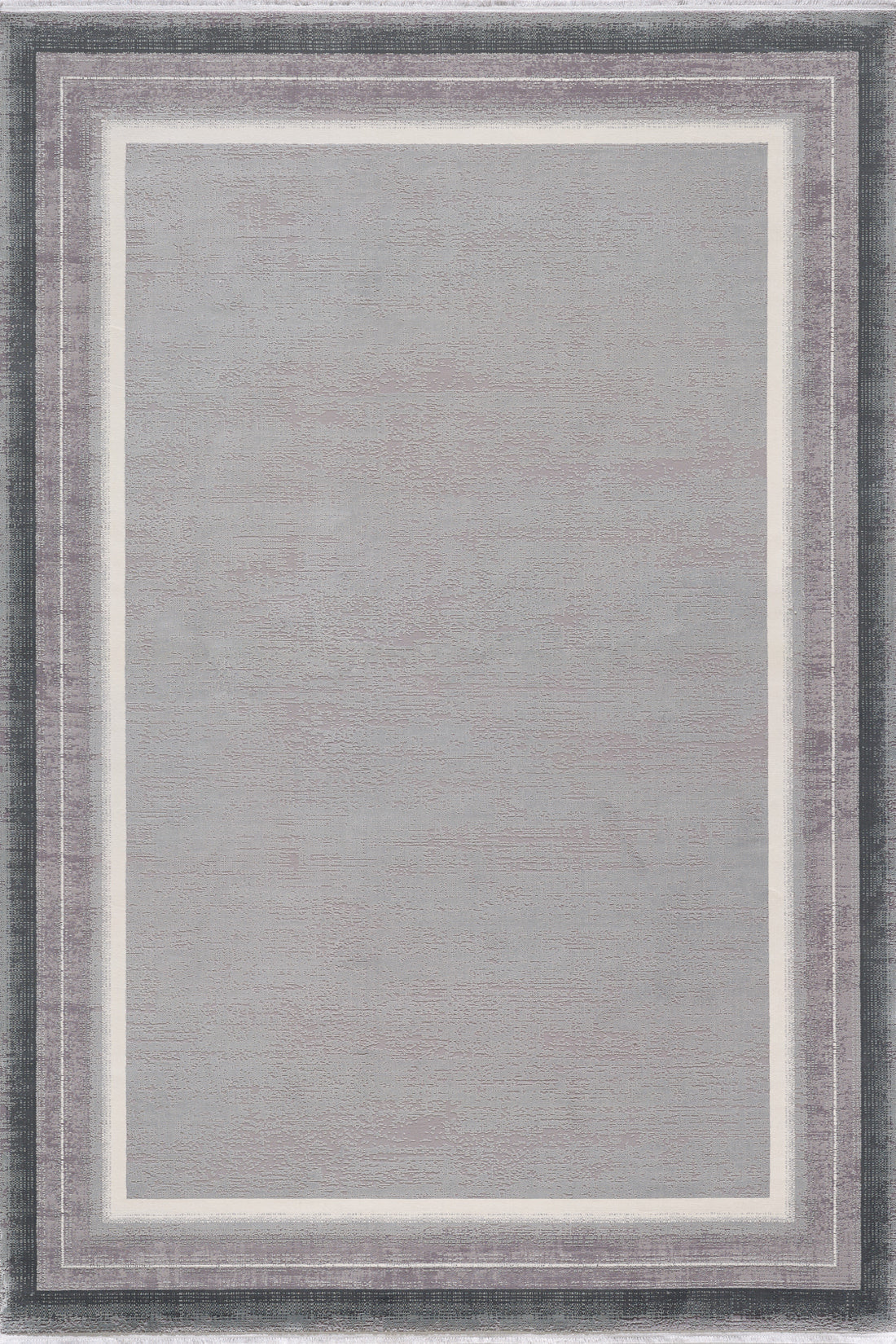 The Radiant Edges Bordered Rug - Silver - M542B features a rectangular design with a light gray center, two slim white lines, and a wide dark gray border for a modern, textured look. This rug is machine-made for durability and style.