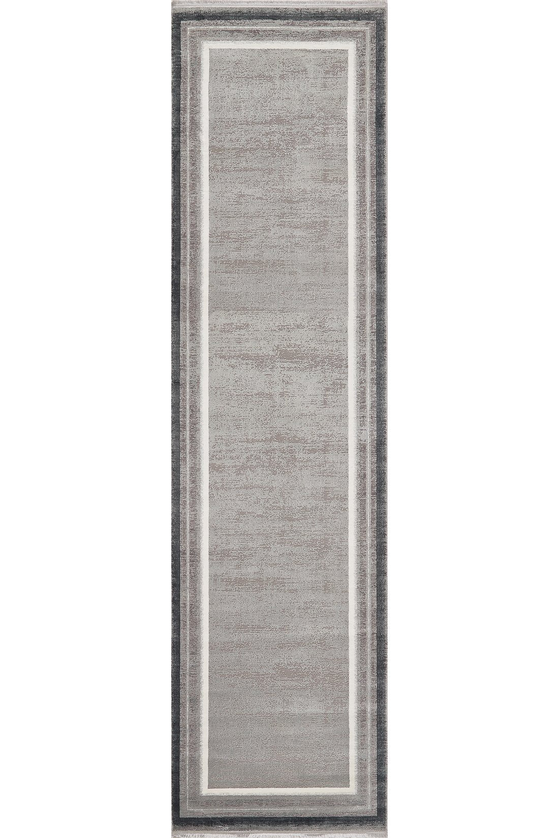 The Radiant Edges Bordered Rug - Silver (M542B) features a light gray center, slim white borders, and a dark gray edge. Its flat pile and modern rectangular design make it perfect for contemporary spaces.