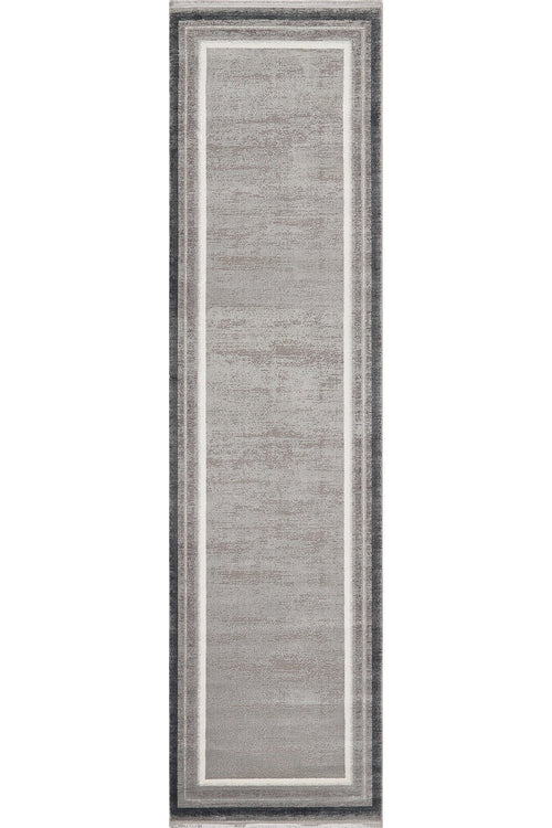 Load image 1 in gallery view. The Radiant Edges Bordered Rug - Silver (M542B) features a light gray center, slim white borders, and a dark gray edge. Its flat pile and modern rectangular design make it perfect for contemporary spaces.