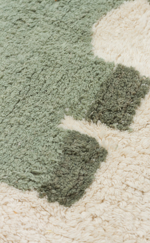 Load image 1 in gallery view. Close-up of the Rainbow Nap - Washable Shaggy - CBN08 rug, featuring light green, dark green, and cream patterns. Its soft, textured fibers make it a cozy and practical choice for kids' playrooms.