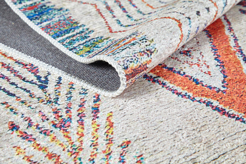 Load image 1 in gallery view. A close-up of the Rainbow Rhapsody - Washable Rug - JR5060 (Custom Size) shows its vibrant orange, blue, and yellow geometric and abstract patterns on a light background. The textured, washable surface is perfect for high-traffic areas.