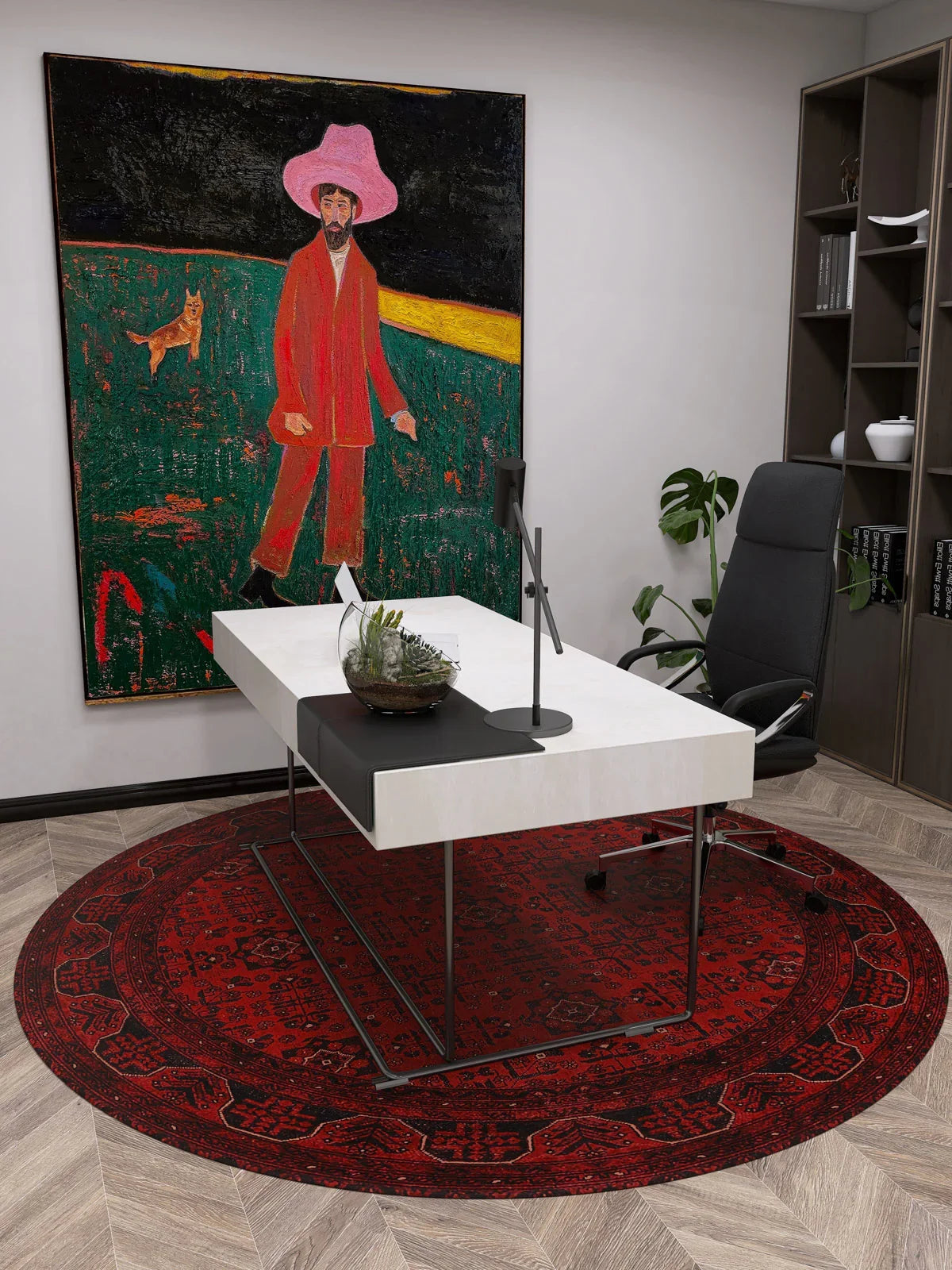 A modern office with a white desk, black chair, and the Regal Accents - Washable Rug - JR36 in red—ideal for high-traffic areas. Behind the desk hangs a vibrant painting of a person in pink and red on grass with a dog. Shelves with books line the right wall.