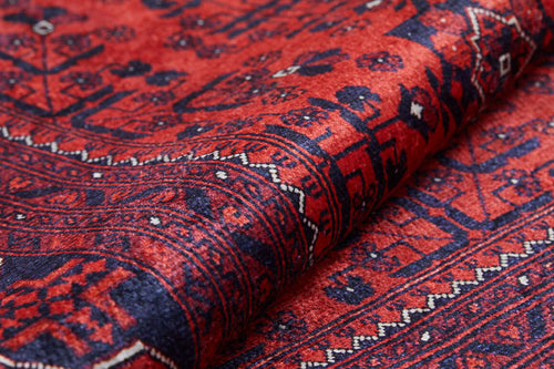 Load image 1 in gallery view. A close-up of the Regal Accents - Washable Rug - JR36 (Custom Size) in red, showcasing intricate geometric and floral patterns with a detailed border—durable and perfect for high-traffic areas.