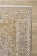 A close-up of the Reimagined Heritage Modernised Medallion Rug - Gold - M642F, featuring ornate beige and gold floral designs, shown on a light wood floor.
