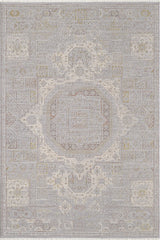 The Revived Legacy Premium Rug - M616M is a rectangular rug with an intricate, symmetrical pattern in gray, beige, and gold tones. Machine-made for style and durability, it features ornate details perfect for any modern space.