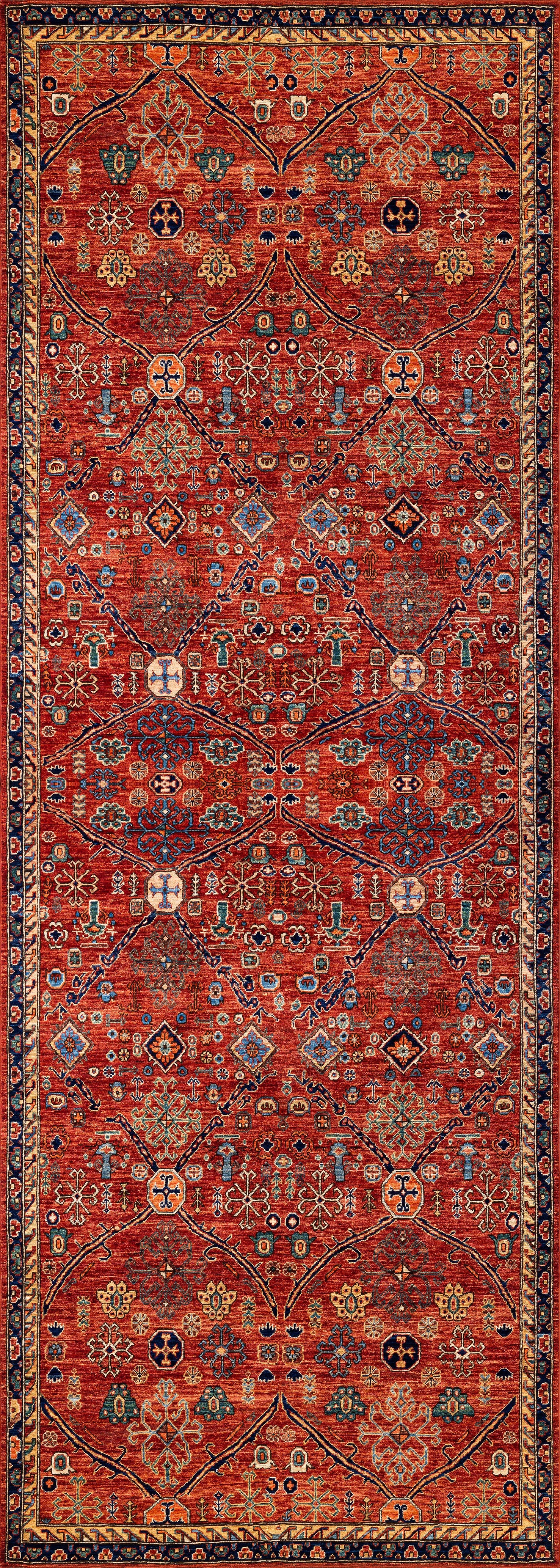 The Rhapsody Authentic Red Washable Rug - LCC3033 showcases a rich red background with geometric and floral patterns in blue, yellow, white, and black, framed by ornate multicolored borders—perfect for high-traffic areas.