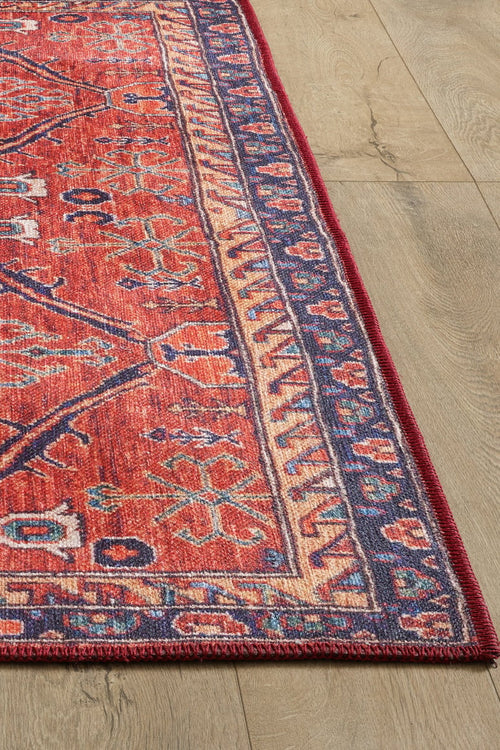 Bild 1 in Galerieansicht laden. A close-up of the Rhapsody Authentic Red Washable Rug - LCC3033 (Custom Size) showcases its geometric motifs and detailed border on a light wood floor, highlighting its visible texture and durability for high-traffic areas.