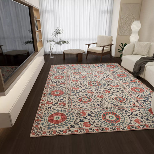 Load image 1 in gallery view. A living room with the Rustic Pearl - Washable Rug - JRN1030 on dark wood floors, a modern armchair, ottoman, white sofa, floor lamp, wall art, potted plant, and a large TV opposite sheer white curtains.