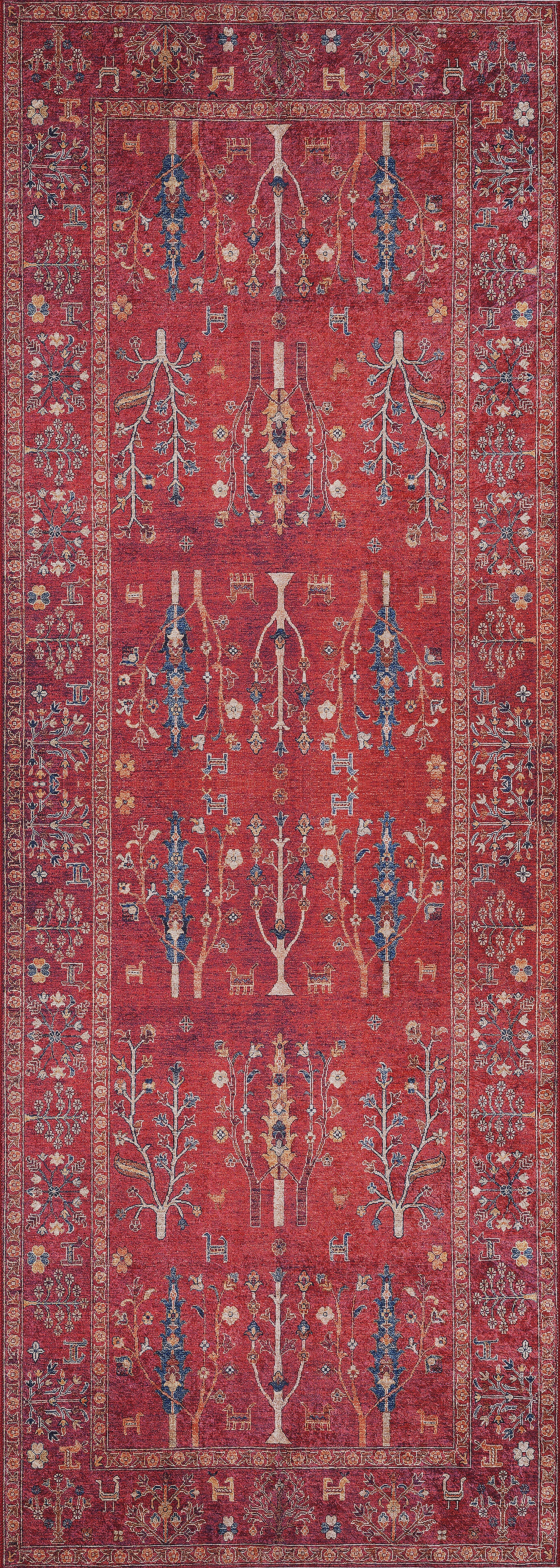 The Rustic Retreat - Washable Rug - JR5095 is a rectangular red rug with symmetrical tree, plant, and geometric patterns in blue, yellow, and cream plus a detailed border—ideal for high-traffic areas and easy to clean.