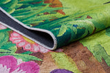A close-up of the Safari Buddies - Machine-Washable Rug JRC041 (Custom Size), featuring a vibrant multicolor floral and leaf pattern, curled edge revealing black non-slip backing and detailed stitching—ideal for high-traffic areas.