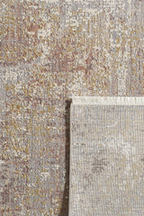 The Sandy Whisper Neutral Rug - M628M is a rectangular, machine-made rug featuring a textured abstract pattern in muted gray, gold, beige, and touches of red. One corner is flipped to show the underside and fringe detailing.