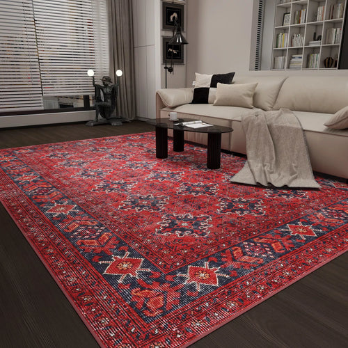 Load image 1 in gallery view. A modern living room featuring the Scarlet Charm - Washable Rug - JRN1032, a light sofa with pillows and a gray blanket, glass coffee table, dark wood floors, bookshelves, and floor-to-ceiling windows with blinds—perfect for high-traffic spaces.