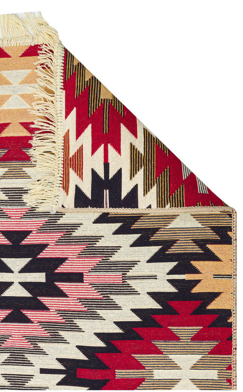 Load image 1 in gallery view. Scarlet Path - Washable Double-Sided Kilims - AR33 features geometric zigzag patterns in red, black, cream, beige, and pink. A folded corner reveals its fringed edge and reversible design.