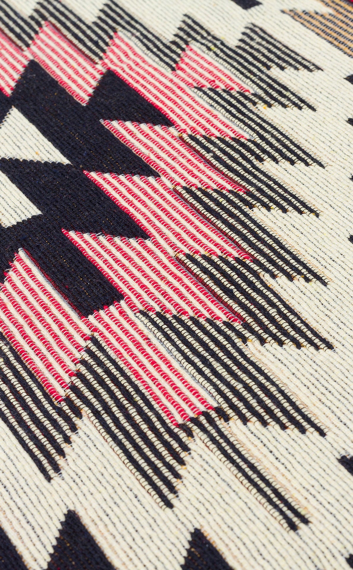 Close-up of Scarlet Path - Washable Double-Sided Kilims (AR33) featuring a bold, geometric pattern in black, red, and white zigzags and diamonds, inspired by traditional southwestern styles. Machine-washable for easy care.