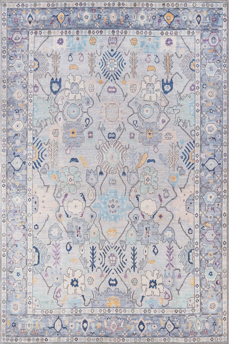 The Seraphix Pastel Bordered Washable Rug - LCC3011 features geometric and floral patterns in pastel blues, lavender, cream, and yellow. Durable and ideal for high-traffic areas, its symmetrical motifs and detailed border add elegance.