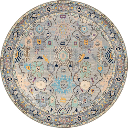 Load image 1 in gallery view. The Seraphix Pastel Bordered Washable Rug - LCC3011 is a round blue rug with ornate geometric and floral patterns in muted pastels and a decorative border. It’s stylish, easy to maintain, and ideal for high-traffic areas.