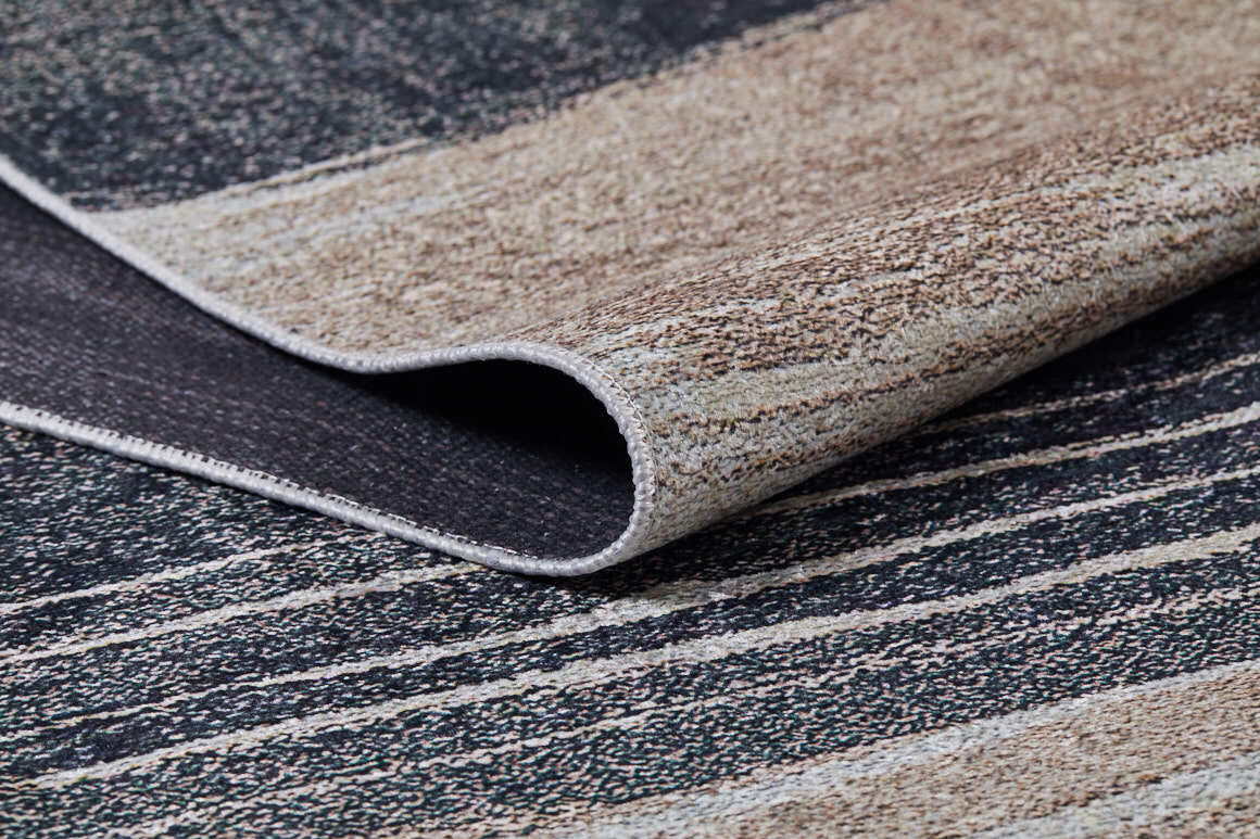 A close-up of the Serene Swirls - Washable Rug - JR952 (Custom Size) in bronze and brown, featuring a textured striped pattern in beige and dark gray—perfect for high-traffic areas with its foldable, washable design.